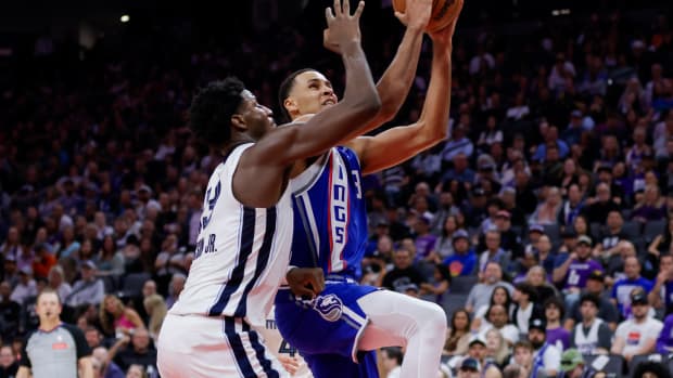 Mar 18, 2024; Sacramento, California, USA; Sacramento Kings forward Keegan Murray (13) drives to the basket against Memphis Grizzlies forward Jaren Jackson Jr. (13) during the second quarter at Golden 1 Center. Mandatory Credit: Sergio Estrada-USA TODAY Sports
